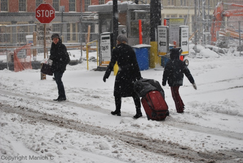 NY-snowfall-lady with suitcase-web